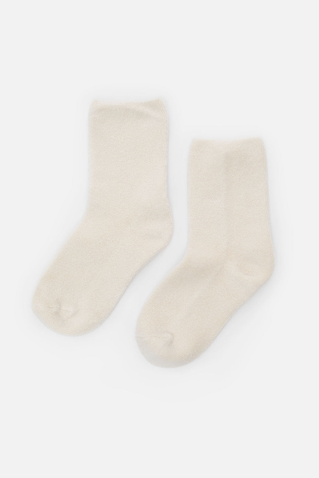 Le Bon Cloud Socks in Ecru by Le Bon: a soft, cream-colored, ankle-length terry knit pair made from US-grown cotton, shown laid flat on a white background.
