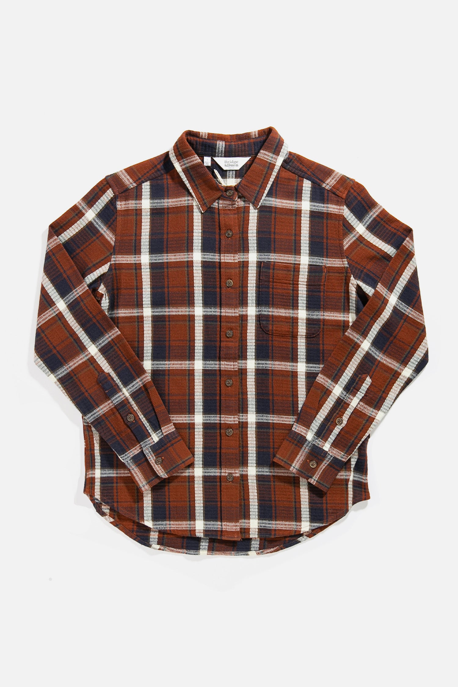 The Bridge & Burn Ash Slim Shirt in Echo Ridge Plaid features a sustainable slim fit, long sleeves, button-up front, chest pocket, and a brown, navy, white, and black plaid pattern for classic casual style.